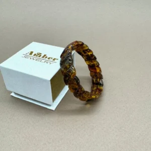 Medaus spalvos Baltijos gintaro apyrankė „Šypsenėlė” su natūraliomis fosilijomis, Honey color Baltic amber bracelet "Smiley" with natural fossil