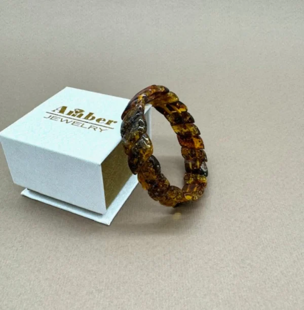 Medaus spalvos Baltijos gintaro apyrankė „Šypsenėlė” su natūraliomis fosilijomis, Honey color Baltic amber bracelet "Smiley" with natural fossil