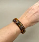 Medaus spalvos Baltijos gintaro apyrankė „Šypsenėlė” su natūraliomis fosilijomis, Honey color Baltic amber bracelet "Smiley" with natural fossil