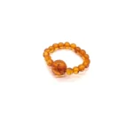 Masažinis gintaro žiedas medaus spalva, Amber massage ring in honey color.