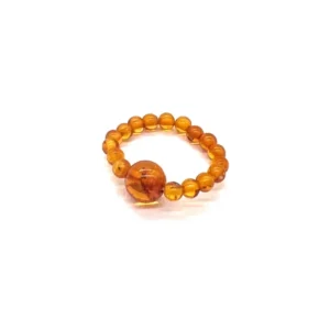 Masažinis gintaro žiedas medaus spalva, Amber massage ring in honey color.