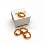 Masažinis gintaro žiedas medaus spalva, Amber massage ring in honey color.