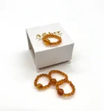 Masažinis gintaro žiedas medaus spalva, Amber massage ring in honey color.