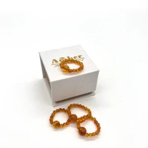 Masažinis gintaro žiedas medaus spalva, Amber massage ring in honey color.