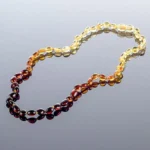 Baltijos gintaro karoliai - mažos vaivorykštės slyvutės, Baltic amber necklace - small rainbow olive beads